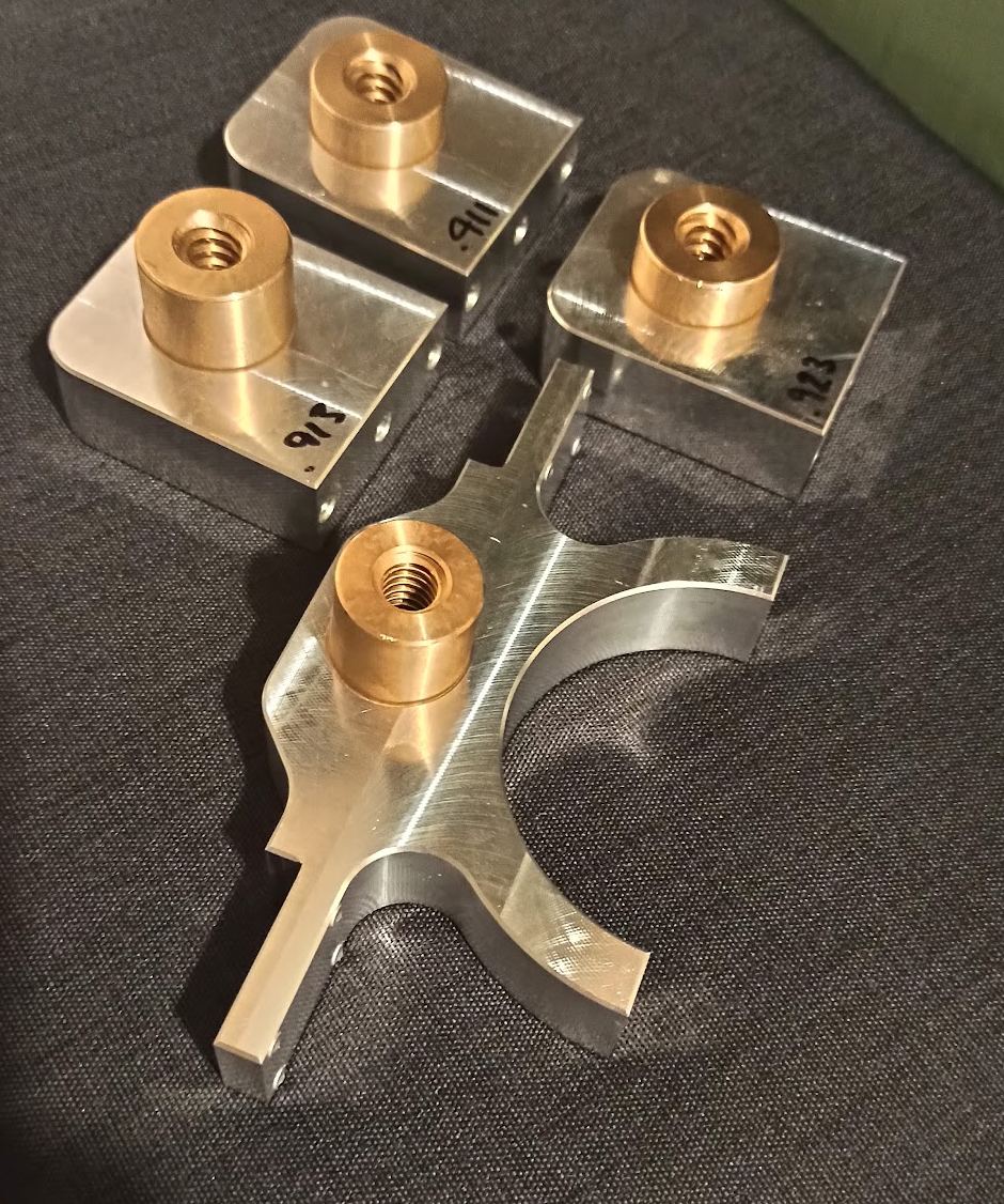 Machined aluminium brackets with lead-screw nut inserts