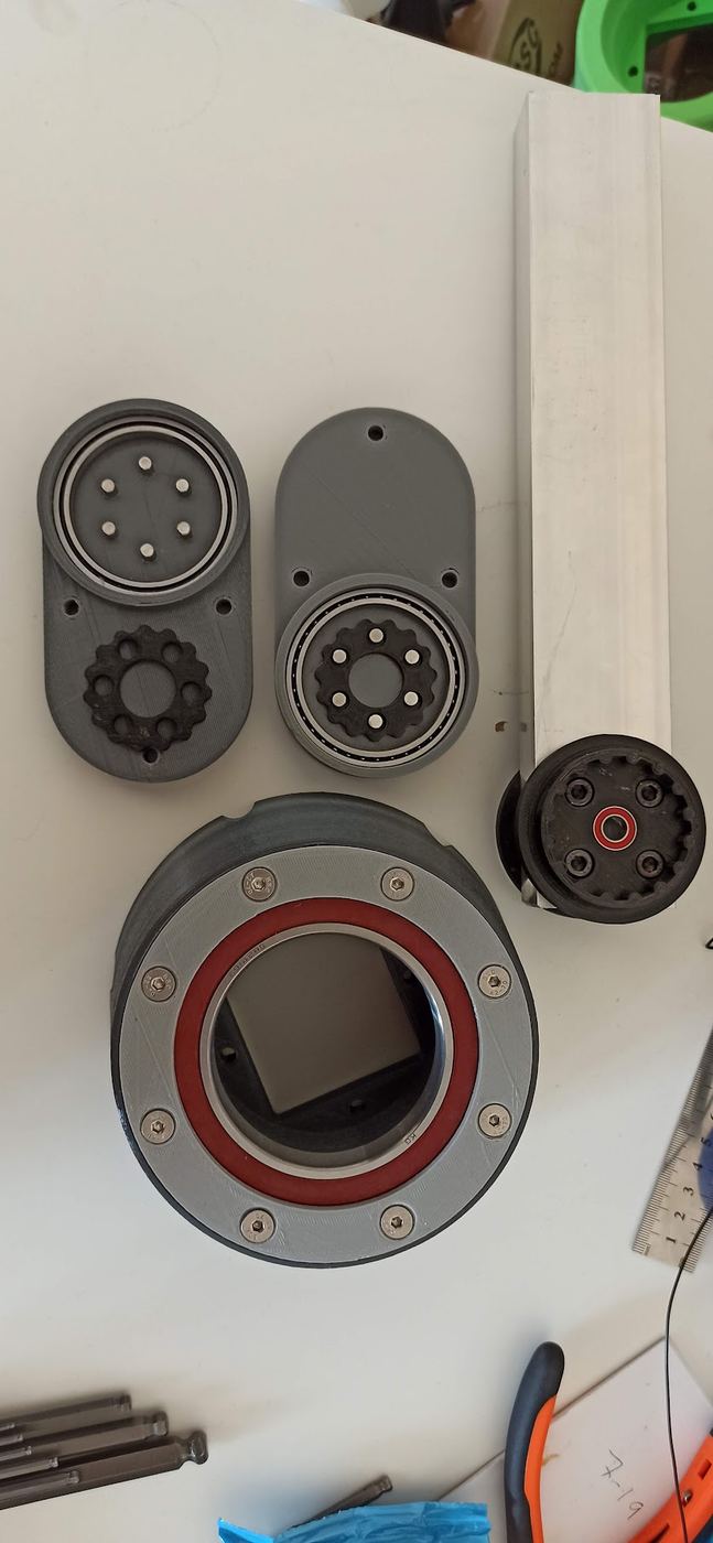 Disassembled actuator modules showing internal gearing